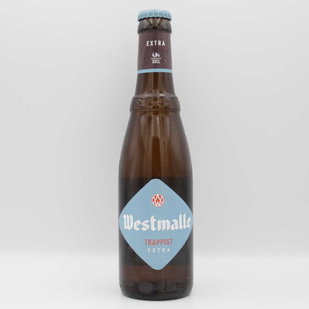 This is a bottle of Westmalle - Extra - 4.8% (330ml). It is a Belgian Style craft beer available to buy from Ghost Whale, voted London's best craft beer shop.