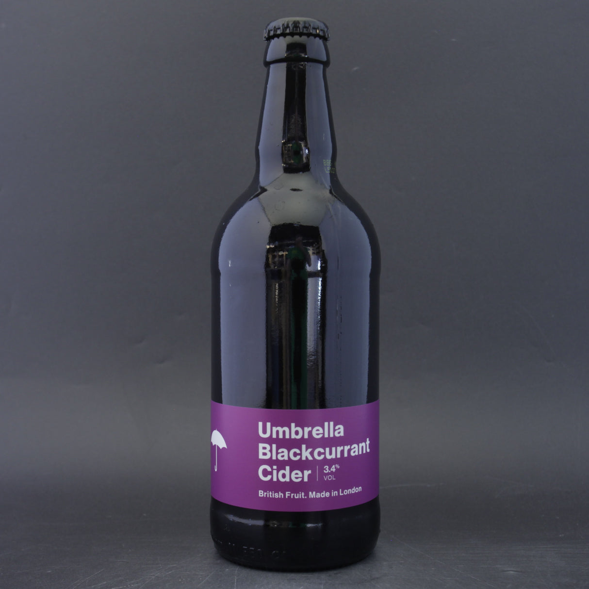 This is a bottle of Umbrella Brewing - Blackcurrant Cider - 3.4% (500ml). It is a  craft cider available to buy from Ghost Whale, voted London's best craft beer shop.