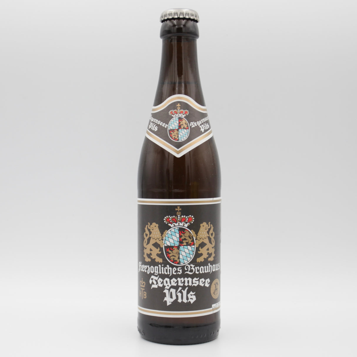 This is a bottle of Tegernseer - Pils - 5% (330ml). It is a Lager / Pilsner / Kölsch craft beer available to buy from Ghost Whale, voted London's best craft beer shop.