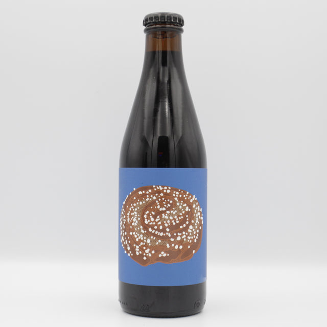 This is a bottle of Omnipollo - Kanelbuller - 13.5% (330ml). It is a Imperial Stout / Porter craft beer available to buy from Ghost Whale, voted London's best craft beer shop.