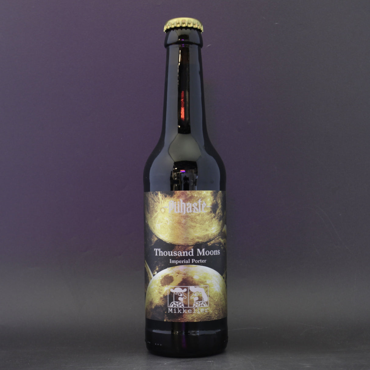 This is a bottle of Puhaste / Mikkeller - Thousand Moons - 11.5% (330ml). It is a Imperial Stout / Porter craft beer available to buy from Ghost Whale, voted London's best craft beer shop.