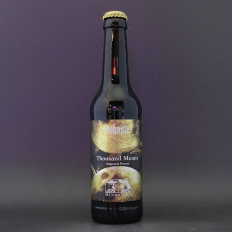 This is a bottle of Puhaste / Mikkeller - Thousand Moons - 11.5% (330ml). It is a Imperial Stout / Porter craft beer available to buy from Ghost Whale, voted London's best craft beer shop.