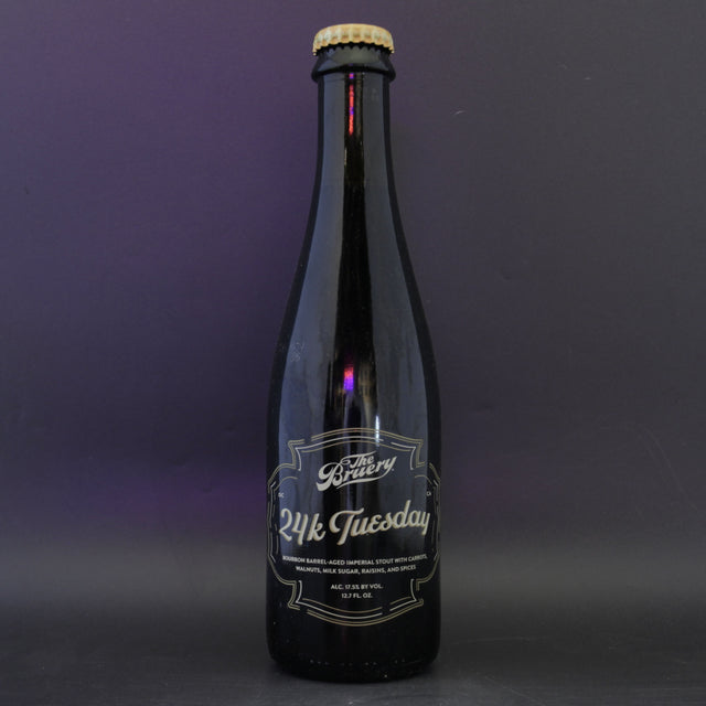 This is a bottle of The Bruery - 24K Tuesday - 17.5% (375ml). It is a Imperial Stout / Porter craft beer available to buy from Ghost Whale, voted London's best craft beer shop.