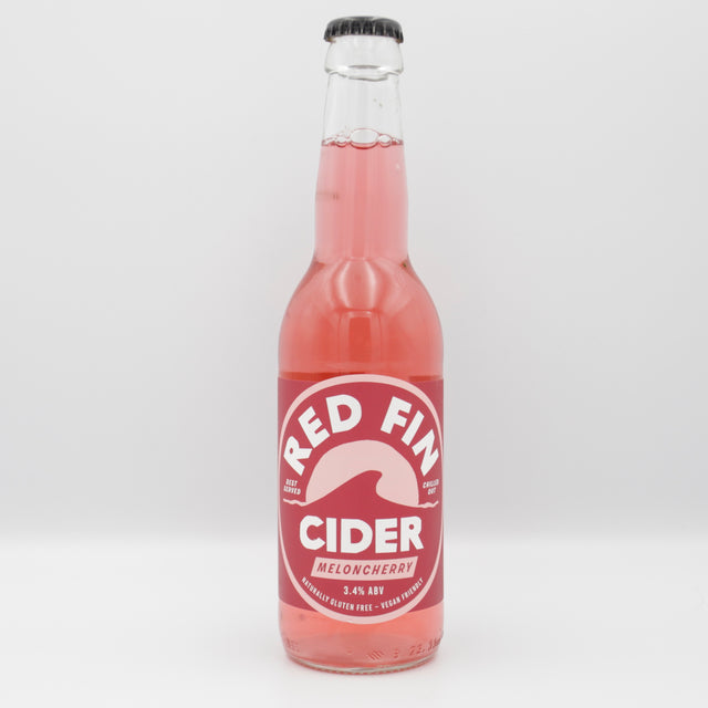 This is a bottle of Red Fin Cider - Meloncherry Cider - 3.4%. It is a  craft cider available to buy from Ghost Whale, voted London's best craft beer shop.