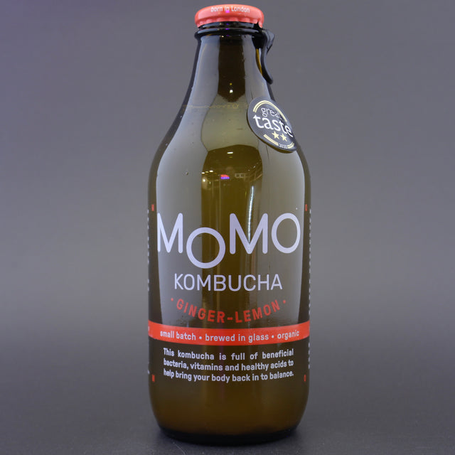 This is a bottle of Momo - Ginger-Lemon Kombucha - 0% (330ml). It is a  craft soft drink available to buy from Ghost Whale, voted London's best craft beer shop.