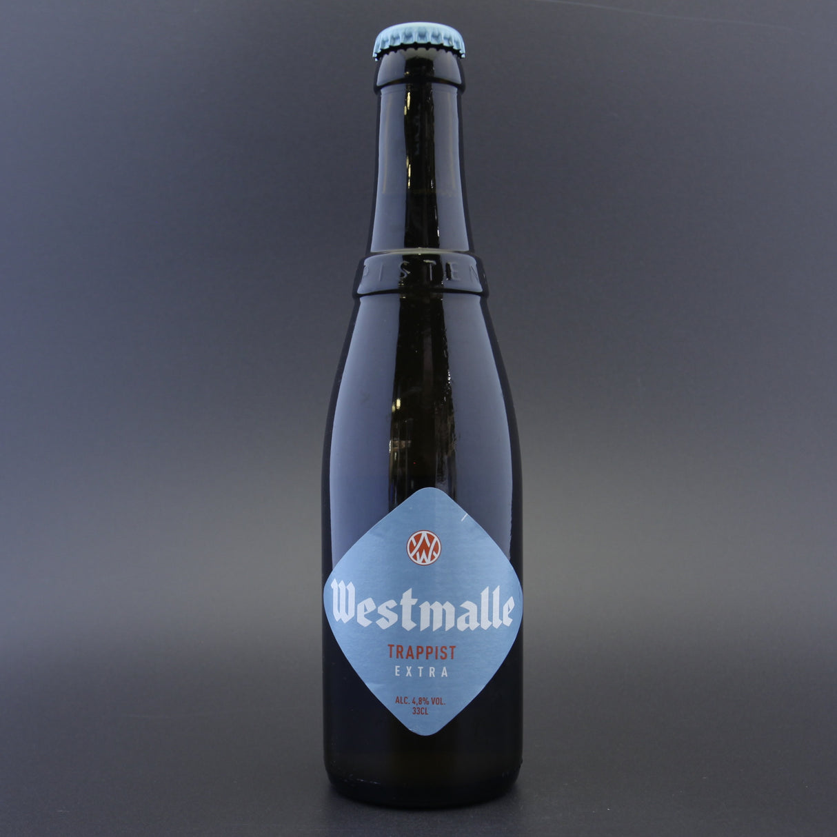 This is a bottle of Westmalle - Extra - 4.8% (330ml). It is a Belgian Style craft beer available to buy from Ghost Whale, voted London's best craft beer shop.