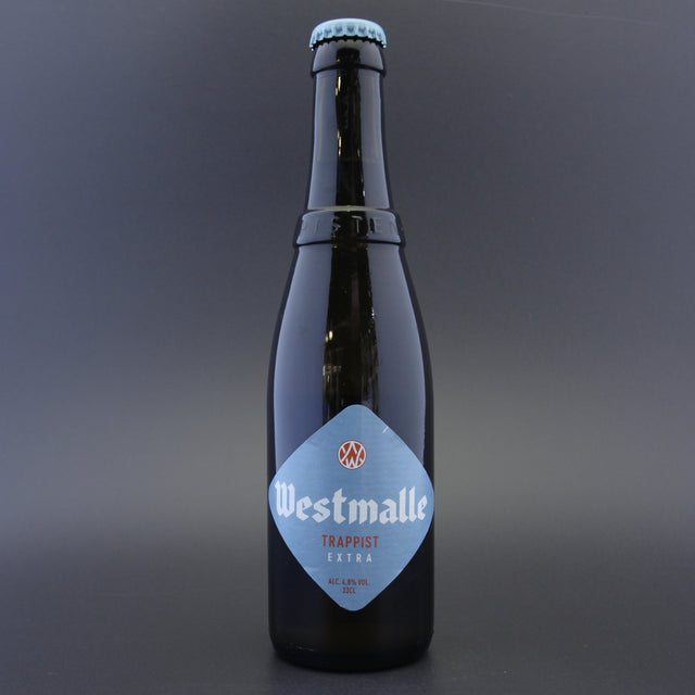 This is a bottle of Westmalle - Extra - 4.8% (330ml). It is a Belgian Style craft beer available to buy from Ghost Whale, voted London's best craft beer shop.